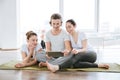 Man and two women using tablet in yoga studio together Royalty Free Stock Photo