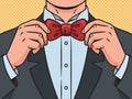 Man tying bow tie pop art vector illustration