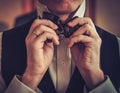 Man tying custom made bowtie