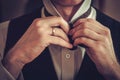 Man tying custom made bowtie