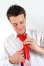 Man tying a red necktie Royalty Free Stock Photo