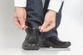 Man tying shoelaces on classic black shoes Royalty Free Stock Photo