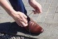 Man tying shoes laces