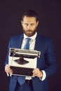 Man with typewriter in fashion business suit