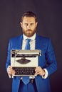 Man with typewriter in fashion business suit