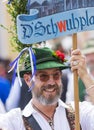 A man in typical bavarian clothes and a hat attending the Gay Pride parade also known as Christopher Street Day CSD in Munich, Ger