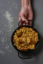 Man with a typical spanish paella valenciana Royalty Free Stock Photo