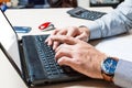 Man typing on the keyboard. Businessman at work. Hands close up