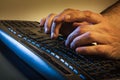 Man typing on a laptop computer Royalty Free Stock Photo