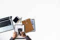 Man typing on laptop computer with white blank screen over white office desk table. Royalty Free Stock Photo