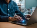 Man typing on laptop with digital shield showing secure cloud data protection Royalty Free Stock Photo
