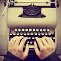 Man typing on an old typewriter Royalty Free Stock Photo