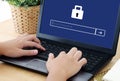 Man typing password on labtop screen background, cyber security Royalty Free Stock Photo
