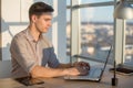 Man typing text or blog in office, hir workplace, using pc keyboard. Busyman working. Royalty Free Stock Photo