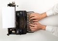Man typing on vintage retro typewriter on white table background top view flat lay from above - journalism, application or writer