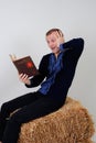 Man in the Ukrainian national costume with a book about busine