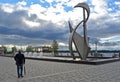 Man with umbrella look at fountain on the Volga embankment Samara, Russia