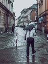 Man with umbrella on rainy day in town Royalty Free Stock Photo