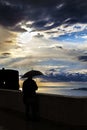 Man with umbrella during storm