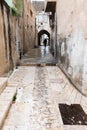 Man with umbrella in the street of Nazareth Royalty Free Stock Photo