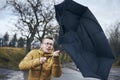 Man with umbrella in wind and rain Royalty Free Stock Photo