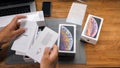 Man unboxing iPhone Xs Max Xr