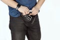 Man unbuttones blue jeans. Man torso, fingerring, blue shirt, casual wear. Royalty Free Stock Photo