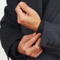 Man unbuttons his sleeve business suit closeup Royalty Free Stock Photo