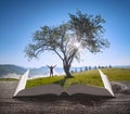 Man under the big tree on a meadow Royalty Free Stock Photo