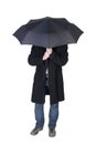 Man under a black umbrella