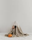 A man under a blanket with a cup in his hand Royalty Free Stock Photo