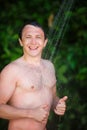 Man under a cold shower Royalty Free Stock Photo