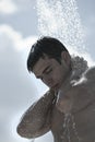 Man under outdoor shower Royalty Free Stock Photo