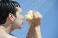 Man under outdoor shower Royalty Free Stock Photo