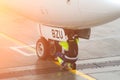 Man under passenger plane looks at the chassis. airport worker concept