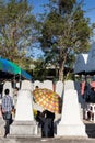 Man Under the Umbrella in The Annual Blessing of Graves at Ratchaburi Province, Thailand Royalty Free Stock Photo