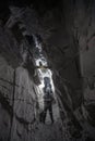 man underground dark light rock tunnel cavern