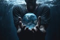 A man underwater holds a crystal ball in the shape of the planet Earth in his hands, generative AI Royalty Free Stock Photo
