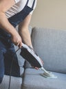 Man in uniform cleaning fabric. Royalty Free Stock Photo