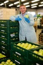 man in uniform offers an apple Royalty Free Stock Photo