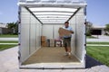 Man unloading portable storage unit Royalty Free Stock Photo