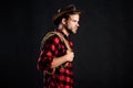 Man unshaven cowboy black background. Man wearing hat hold rope. Lasso tool of American cowboy. Lasso is used in rodeos Royalty Free Stock Photo