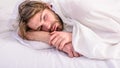 Man unshaven handsome relaxing bed. Man sleepy drowsy unshaven bearded face covered with blanket having rest. Guy lay