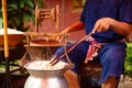 Man Unwinding Silk From Cocoons In Large Hot Pot Royalty Free Stock Photo