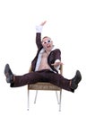 Man in the unzipped shirt on a chair