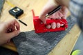 Man upholstering chair in his workshop