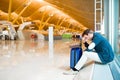 Man upset, sad and angry at the airport his flight is delayed Royalty Free Stock Photo