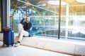 Man upset, sad and angry at the airport his flight is delayed Royalty Free Stock Photo