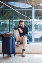 Man unhappy and frustrated at the airport his flight is cancelled Royalty Free Stock Photo