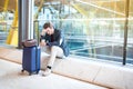 Man unhappy and frustrated at the airport his flight is cancelled